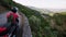 Man on a motorbike rides on a serpentine road of the Douro Valley, Porto