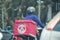 A man on a motorbike to deliver ordered food