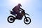 Man, motorcycle or bike jump air as professional rider in danger competition, fearless or race. Male person, off road