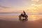 Man And Motorcycle On Ocean Beach At Beautiful Tropical Sunset. Biker Silhouette On Motorbike.