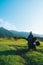 Man motorcyclist ride touring motorcycle. Alpine mountains on background. Biker lifestyle, world traveler. Summer sunny sunset day