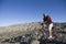 Man With Mountain Bike In An Arid Landscape