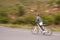 Man, mountain bike and cycling on road for nature adventure, speed or outdoor extreme sports. Male person or cyclist on