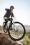 Man, mountain bike and off road cycling in fitness for nature adventure or outdoor extreme sport. Male person or cyclist