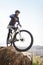 Man, mountain bike and off road cycling on nature adventure or fitness in outdoor extreme sport. Male person or cyclist