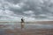 man mountain biking in autumn on the beaches of northern France with the English Channel on the horizon