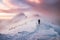 Man mountaineer walking with snow footprint on snow peak ridge i