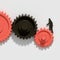Man moving black and coral gear cogs that work together on white background, 3d render, 3d illustration
