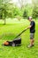 Man Mowing Grass Side View
