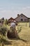 Man mowing his lawn using riding lawnmower