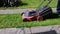 Man Mowing His Yard With Electric Lawn Mower