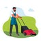 Man Mowing The Lawn. Professional gardener using garden machinery, equipment and tools mowing, cutting, trimming grass
