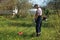 A man mows the grass on the lawn mowers. Overalls and tools