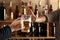 Man with mug of beer and woman refusing to drink in bar