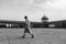 Man in muslim dress walking across the empty Jama Masjid during Ramdan