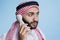 Man in muslim scarf speaking on phone