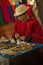 A man in national dress sells souvenirs at the Sibambe railway station, Ecuador.