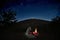 Man Near Campfire Under Etna Volcano And Starry Sky, Sicily