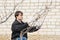 A man near her house does pruning of fruit trees