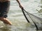 Man with nets in Lake Caldaro_flat