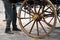 A man with next to traditional carriage waits for tourists in the old town