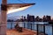 Man observing Boston skyline from pier park