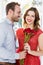 Man offering flower bouquet to woman