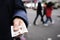 Man offering some pound sterling banknotes