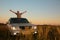 Man with offroad car in field