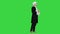 Man in old-fashioned laced frock coat and white wig thinking on a Green Screen, Chroma Key.
