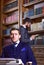 Man in oldfashioned suit, young author sit near typewriter