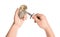 Man opening oyster with knife on white background