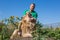 The man opens the jaws of a lion in safari park Taigan, Crimea,