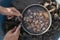 Man opens mussel shells