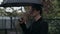 Man opens umbrella at rain