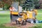 Man operates a stump grinder in a yard