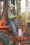 Man Operating Backhoe