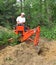 Man operating backhoe