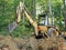 Man operating backhoe