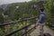 Man is operating drone with a Plitvice waterfalls background