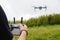 Man operating a drone with remote control.advanced flight controller drone applications that run on a smartphone with wireless