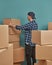 Man organizing cardboard boxes