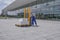 Man in overall operates an electric stacker loaded with boxes