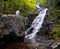 Man overlooks Overall Run waterfall