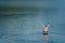 man on paddleboard in the middle of the lake