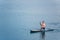 man on paddleboard in the middle of the lake