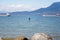 A man paddleboarding near Locarno Beach, Vancouver, Canada.