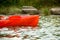 Man Paddling Kayak on Beautiful River or Lake among Stones at the Evening