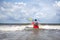 Man paddling kayak on the big wave in rough sea