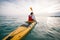 Man paddling yellow sea kayak